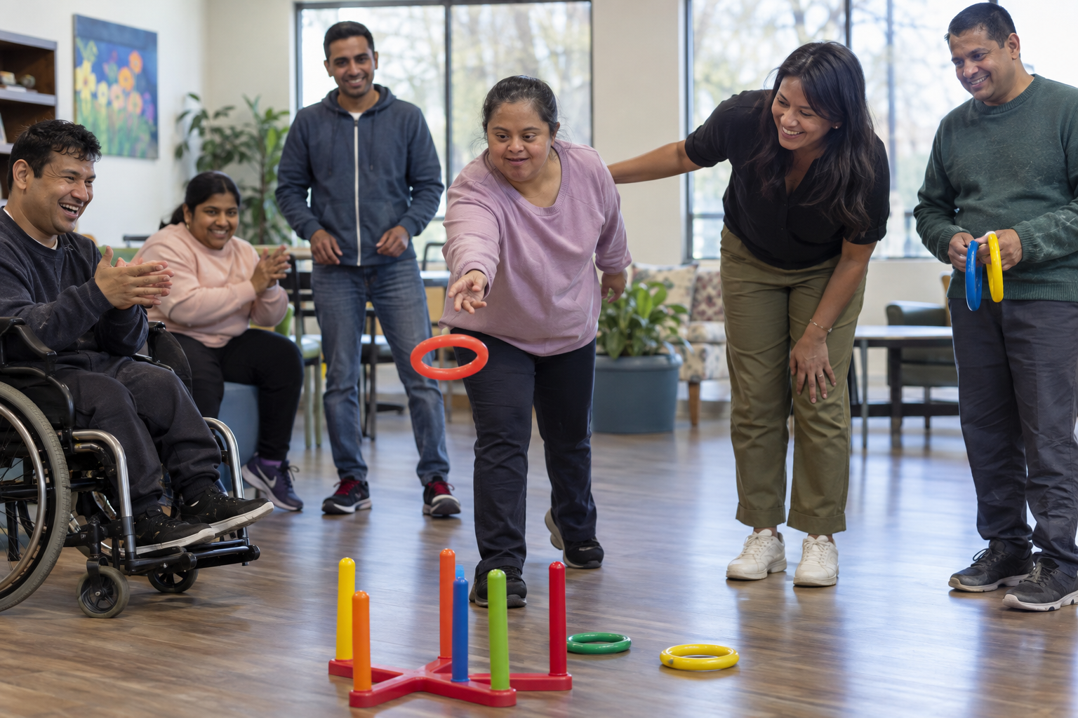 Adults participating together in an accessible ring toss activity